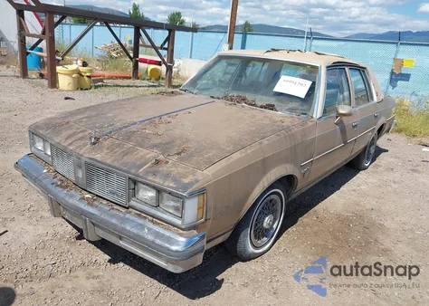 1985 Oldsmobile Cutlass Supreme Brougham from USA, damaged, VIN 1G3GM69Y7FR413133